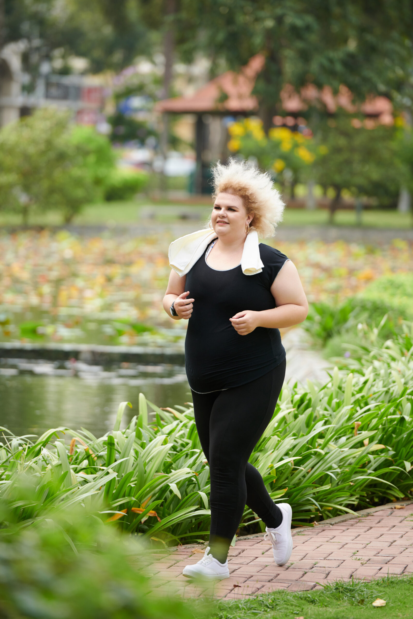 curvy woman jogging in park 2023 11 27 05 34 57 utc scaled